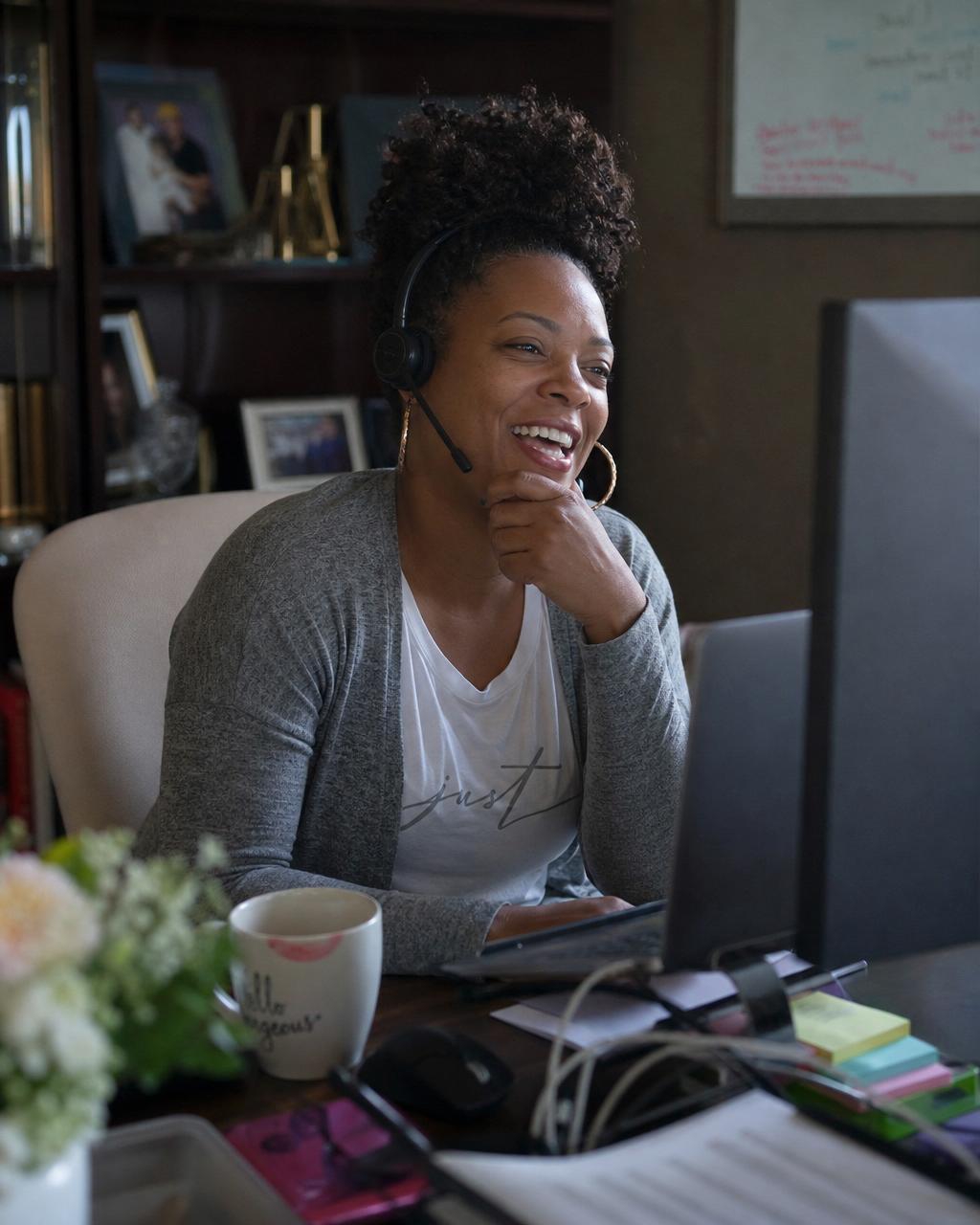 Professional virtual assistant working from a tidy home office with headset